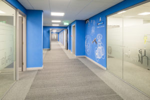 Grey Desso carpet tiles installed in Spear & Jackson corridor