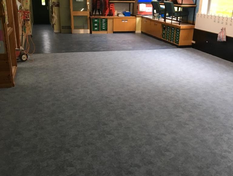 Grey Forbo Flotex flooring and grey Polysafe flooring installed in school classroom